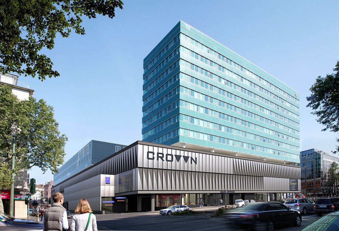 Architectural Visualization of the Crown Düsseldorf building in daylight, showcasing a turquoise glass façade and a modern base with geometric design details.